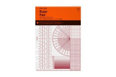Packaged A5 ruler underlay showing red scale markings and an orange header card.