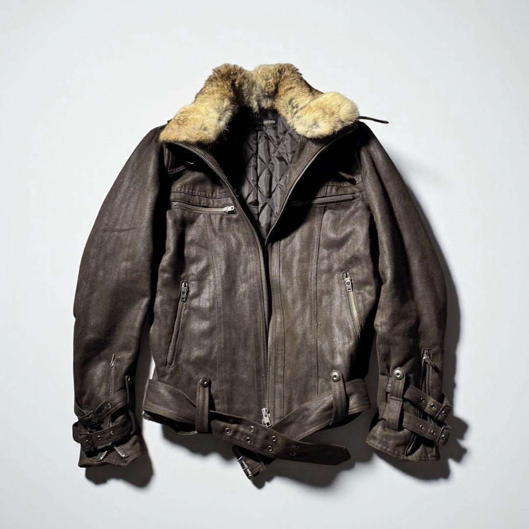 Front view of a men's synthetic leather jacket with a fur collar, zip front, chest pockets, and belted hem laid flat.