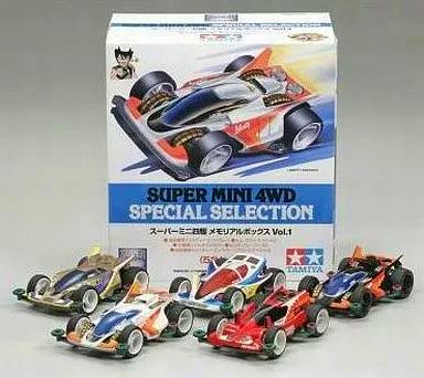 Five assembled 1/32 Super Mini 4WD model cars displayed in front of the product's Memorial Box Vol.1 packaging.