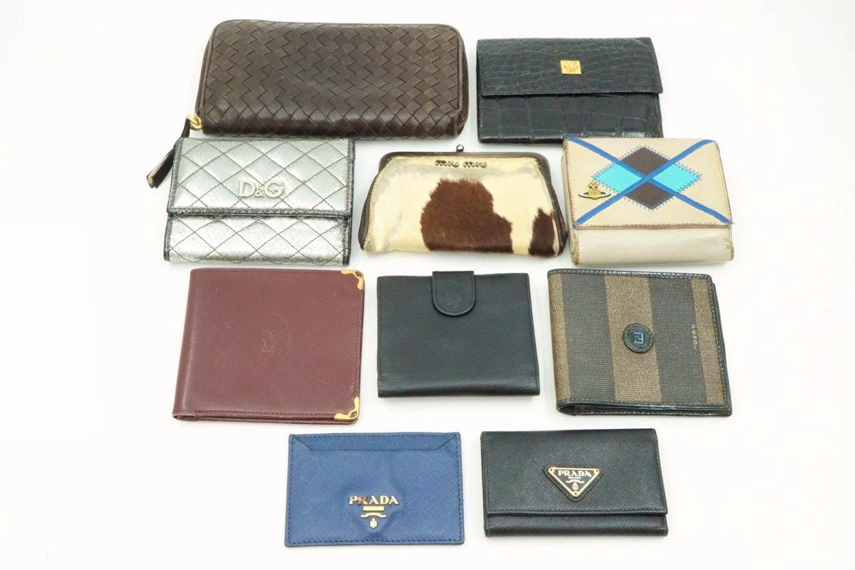 Ten wallets of various brands arranged on a white background.