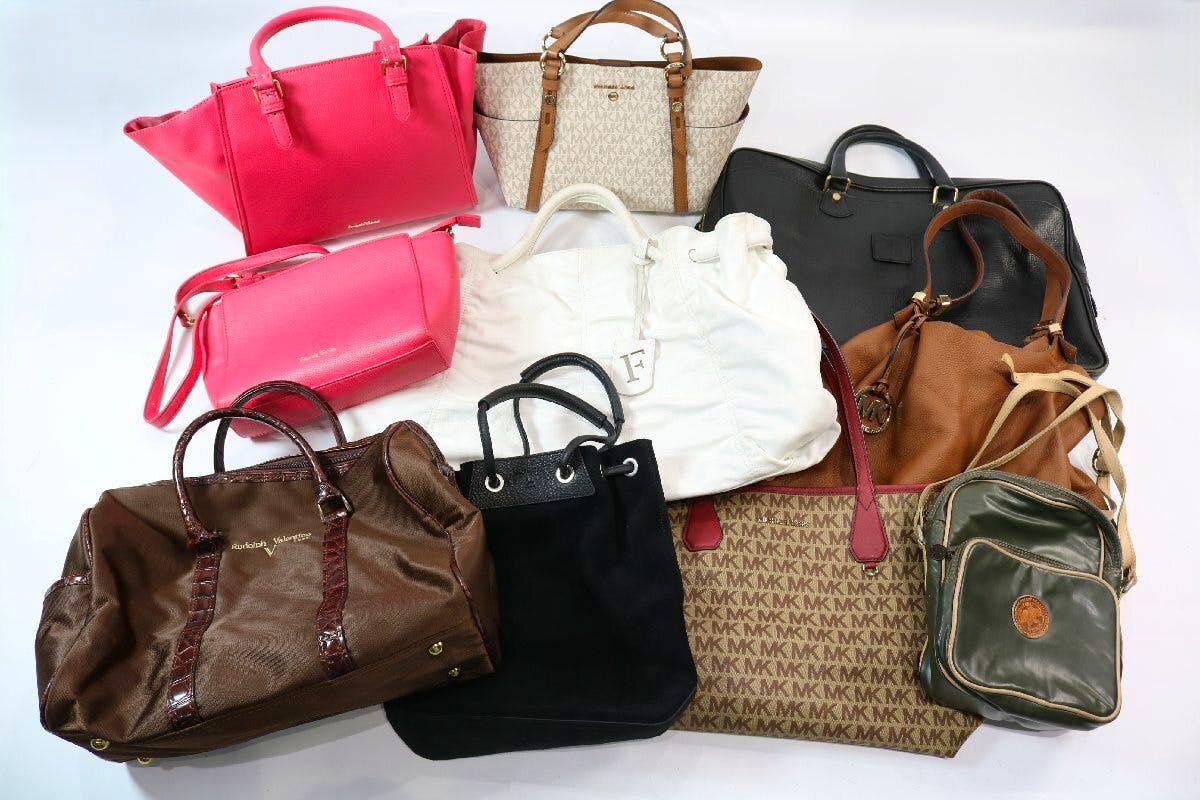Group photo of the ten handbags and shoulder bags included in the lot arranged on a white background.
