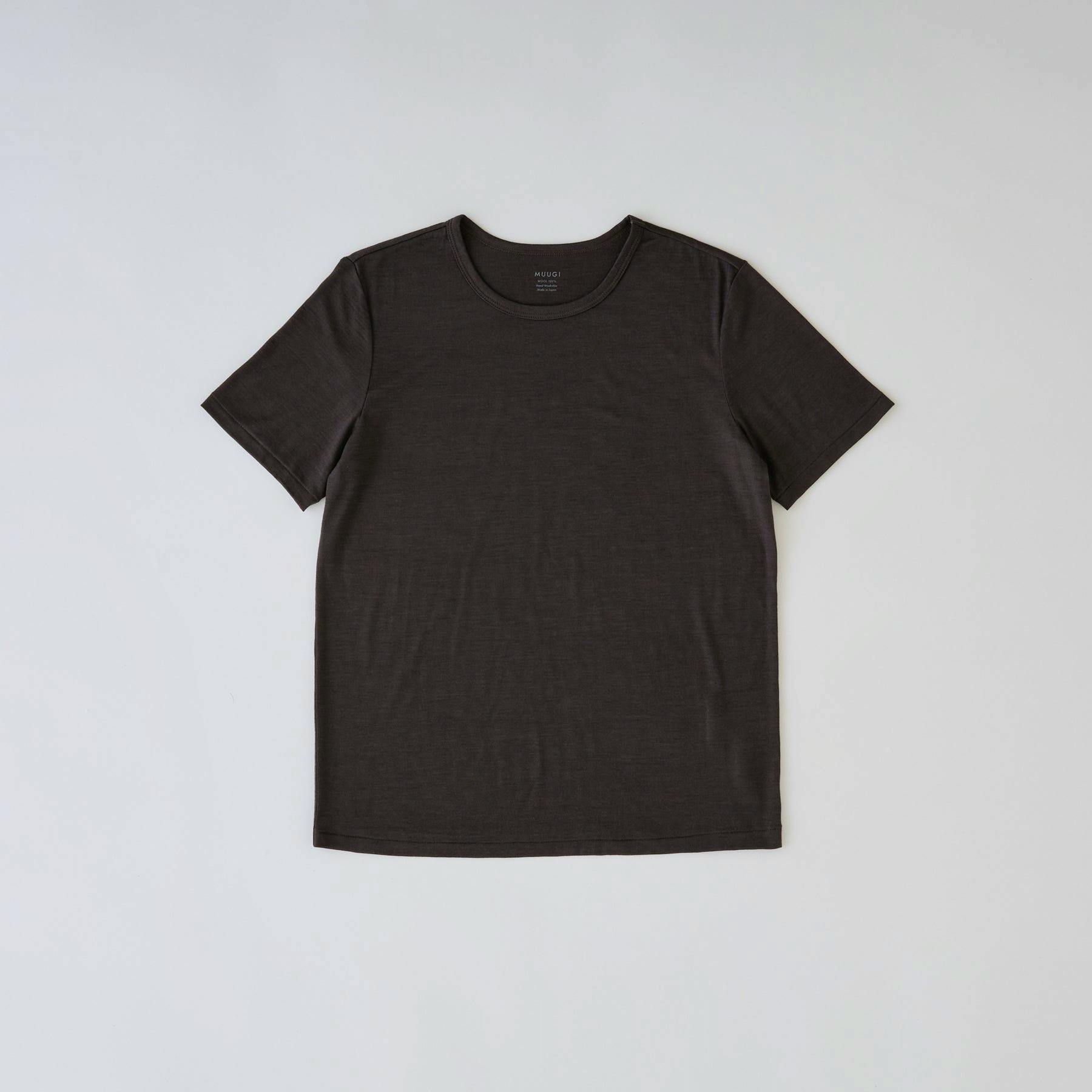 Flat-lay charcoal crew-neck short-sleeve merino wool tee laid flat on a light background.