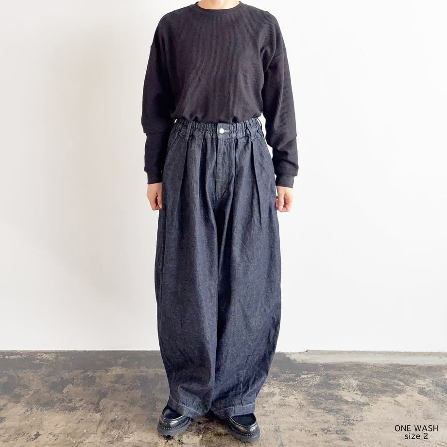 Front view of the 10oz denim circus pants (one wash) worn by a model showing full length and fit.