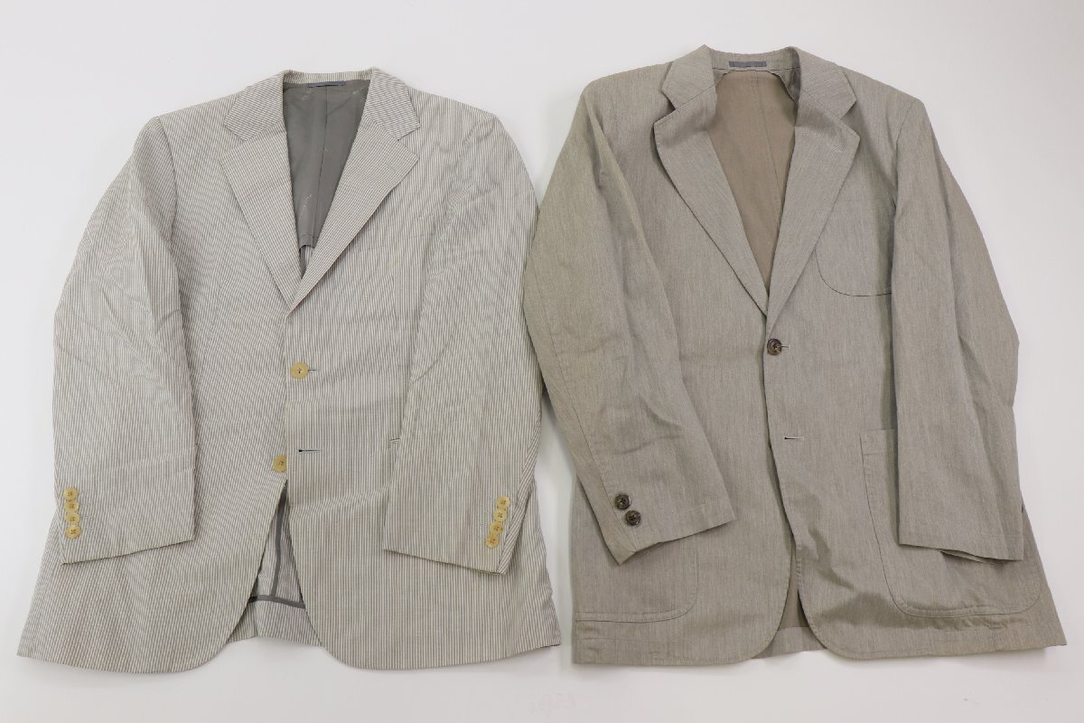 Two Burberry men's wool jackets laid flat on a white background.