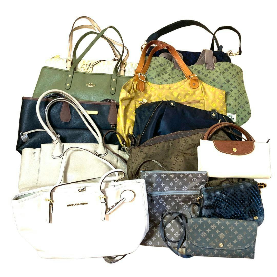 Assorted branded handbags and purses arranged together on a white background showing the bag set.