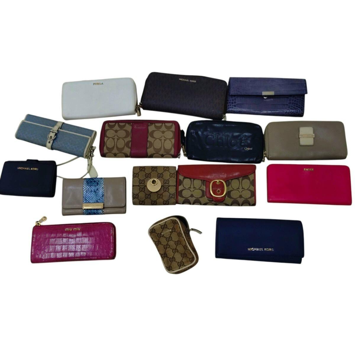 Fifteen wallets and small leather goods arranged on a white background, shown together as a set.