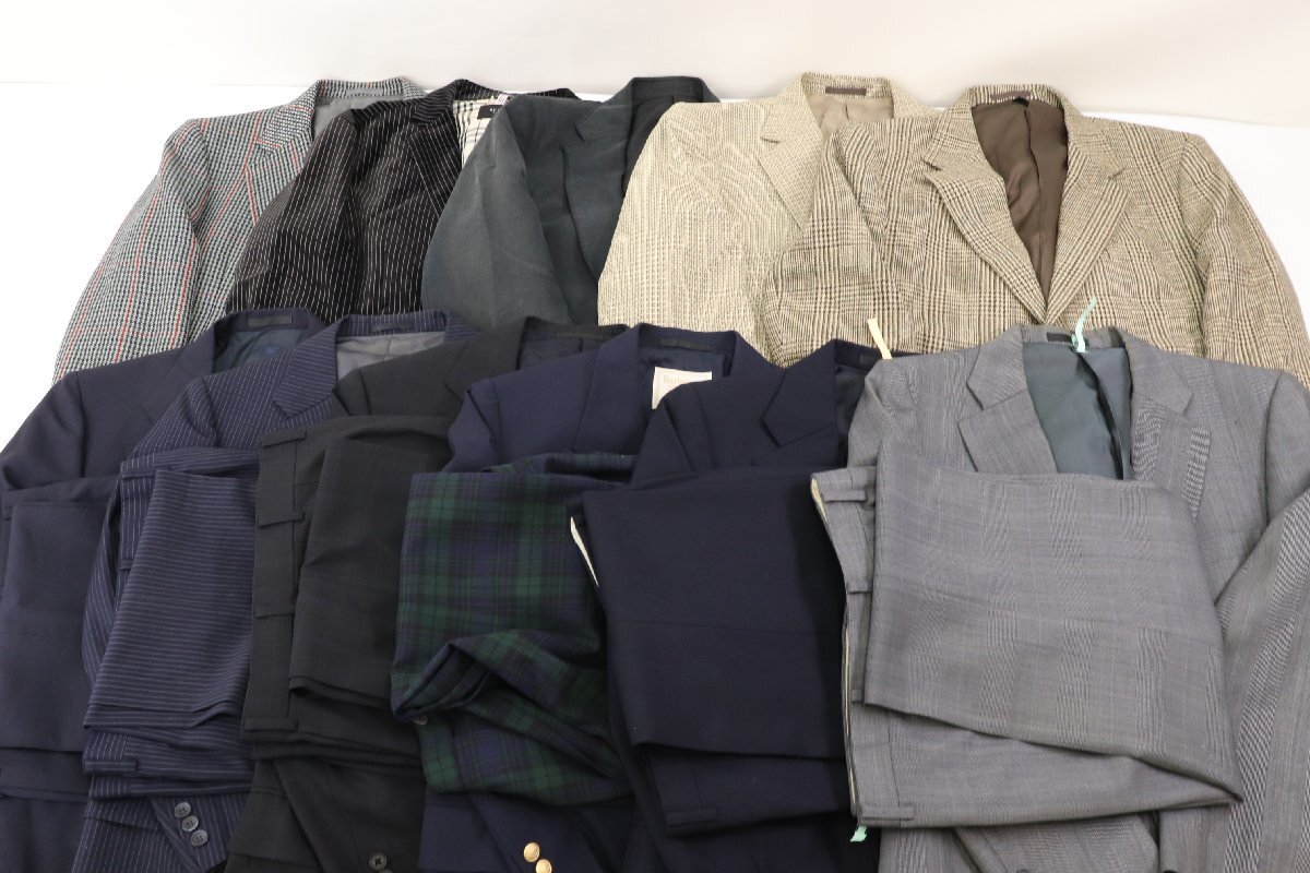 Multiple men's jackets and slacks laid out together as a bundled lot.