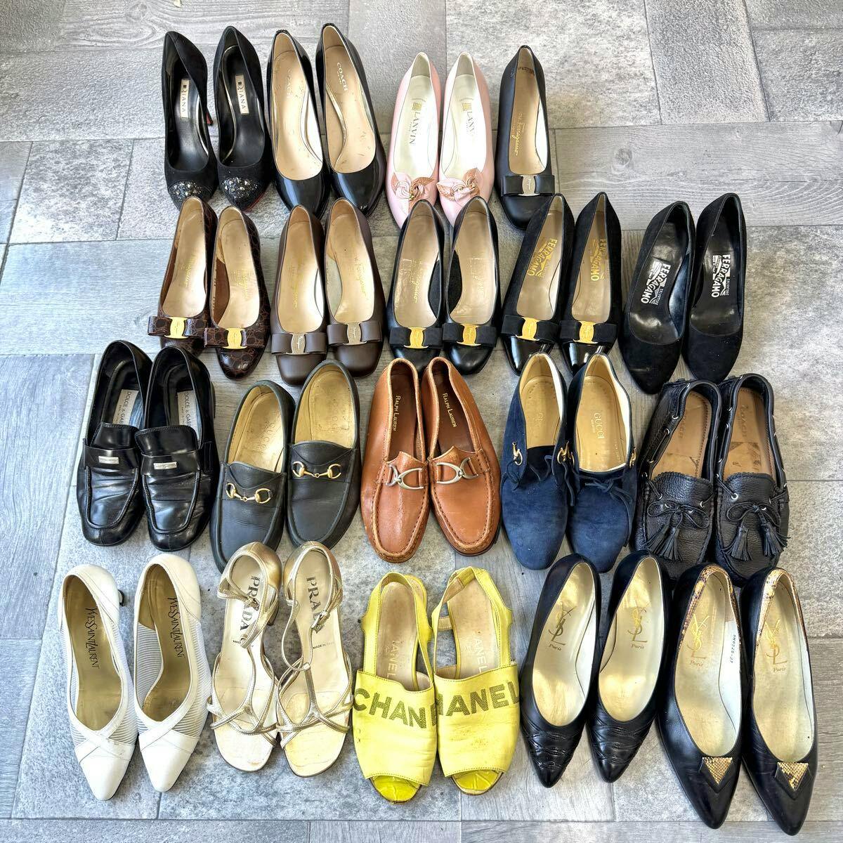 Top-down photo of multiple pairs of leather shoes (pumps and loafers) arranged on a tiled floor.