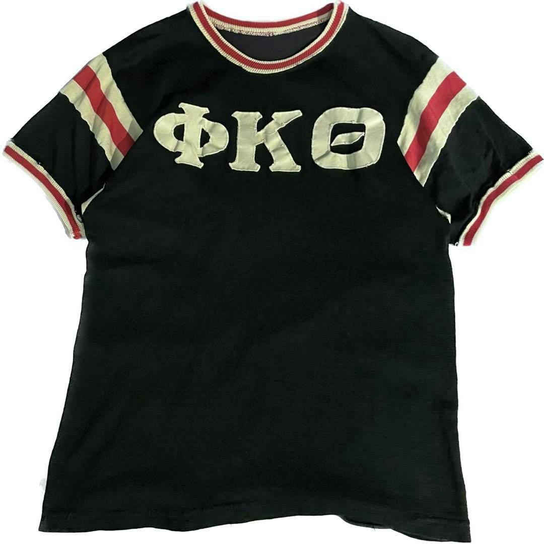Flat-laid black vintage athletic college tee with white Greek-letter appliqués and red-and-white striped collar and sleeve trim.