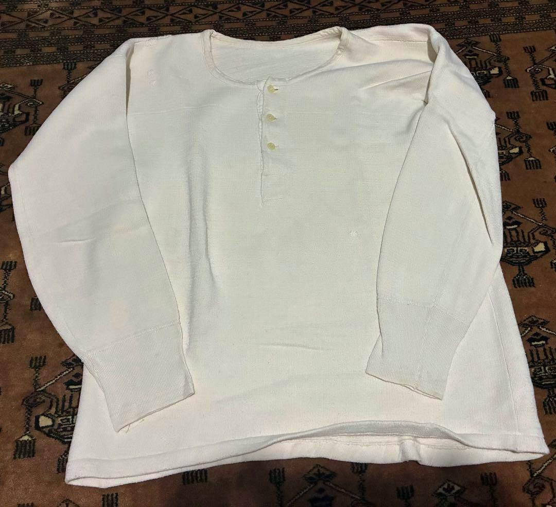 Vintage 50–60s French white cotton Henley-neck long-sleeve T-shirt laid flat showing the front and sleeves.