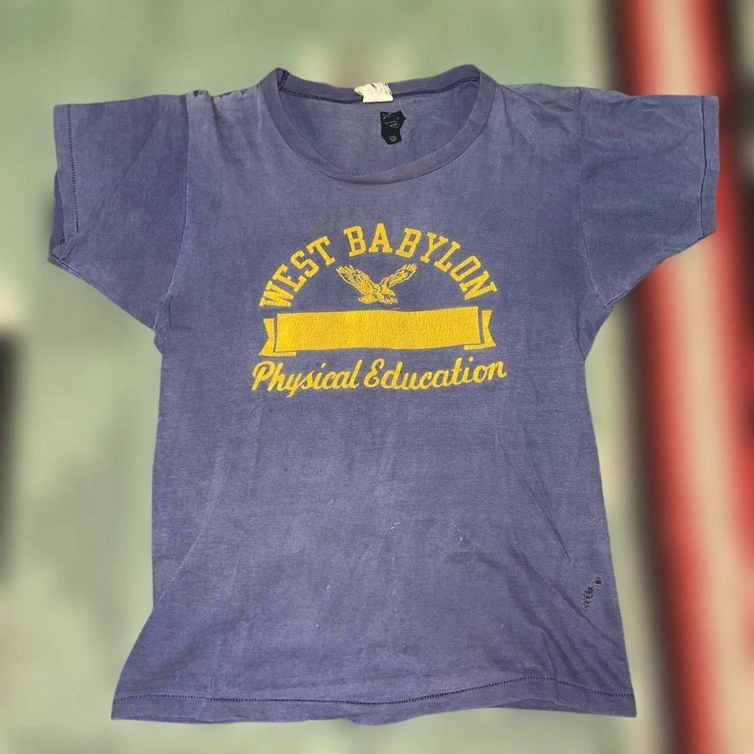 Front view of a blue vintage men's T-shirt with a yellow "West Babylon Physical Education" print.