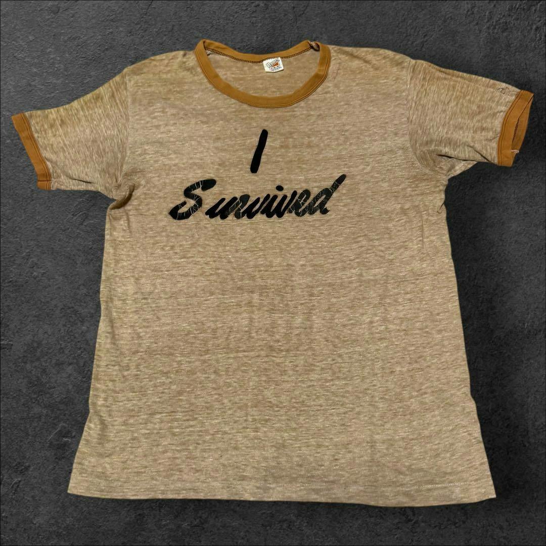 Front view of the men's ringer T-shirt with contrasting collar and sleeve bands and 'I Survived' printed on the chest.