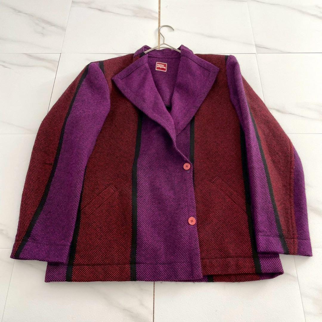 Flat-lay photo of the women's wool jacket showing purple and burgundy vertical panels and two front buttons.
