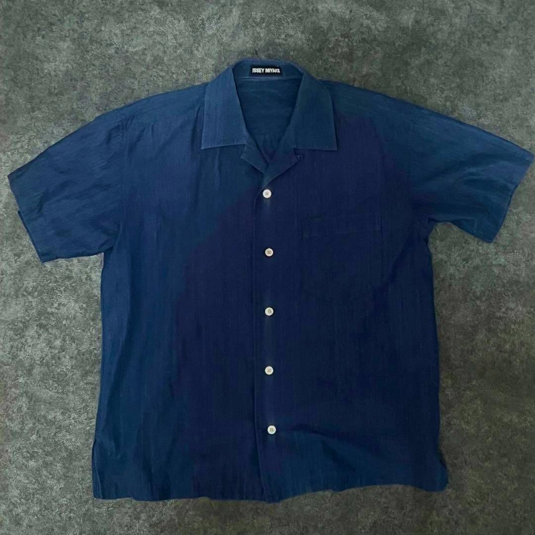 Front view of the 80s ISSEY MIYAKE open-collar men's cotton short-sleeve shirt laid flat showing buttons and the brand label.