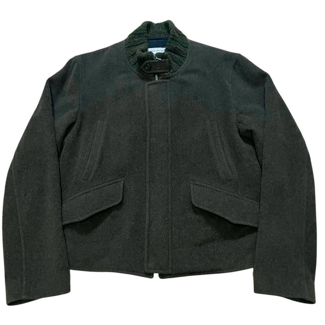 Front view of the 90s Dries Van Noten dark wool jacket laid flat showing the collar and front flap pockets.