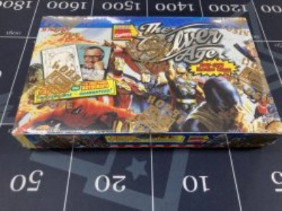 Factory-sealed box of 1998 Skybox Marvel "The Silver Age" shown on a black mat with measurement markings.
