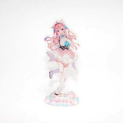 Photo of the acrylic stand featuring a pink-haired character figure on its base against a white background.