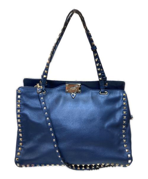 Front view of the 2WAY rock-studded tote bag in blue cow leather with studded edges and two straps.