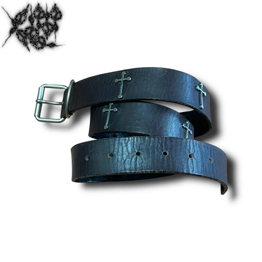 Black cow leather belt with multiple silver cross studs and a metal buckle displayed coiled on a white background.