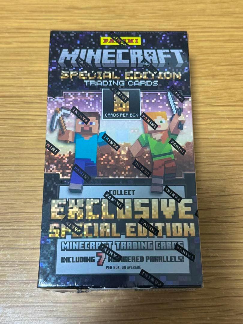 Front of a sealed 2025 Panini Minecraft Special Edition trading cards box on a wooden surface.