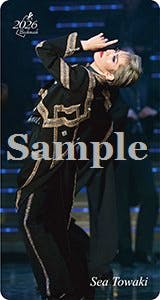 Bookmark showing a person in a stage costume striking a pose, with a large "Sample" watermark and the text "Sea Towaki" visible.
