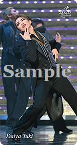 A bookmark image of a performer in a black suit striking a dramatic dance pose on stage with the word "Sample" across the center.