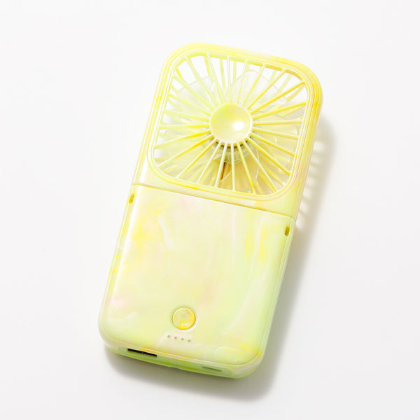Yellow sheer-marble handheld fan on a white background, showing the fan grill, power button, and charging port.
