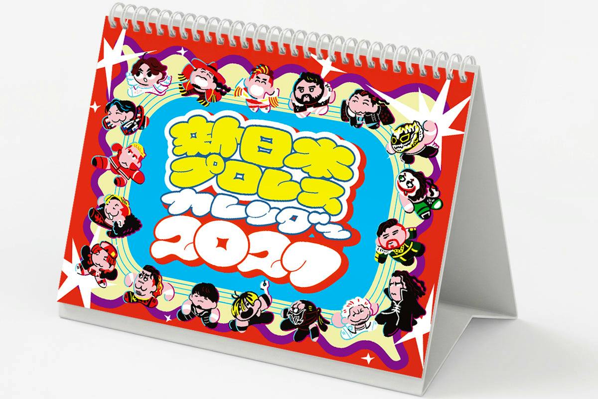 Desk calendar (2027 New Japan Pro-Wrestling) with a spiral top and colorful cartoon cover displayed on its easel stand.