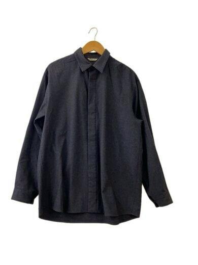 Front view of a grey wool flannel shirt hanging on a wooden hanger against a white background.
