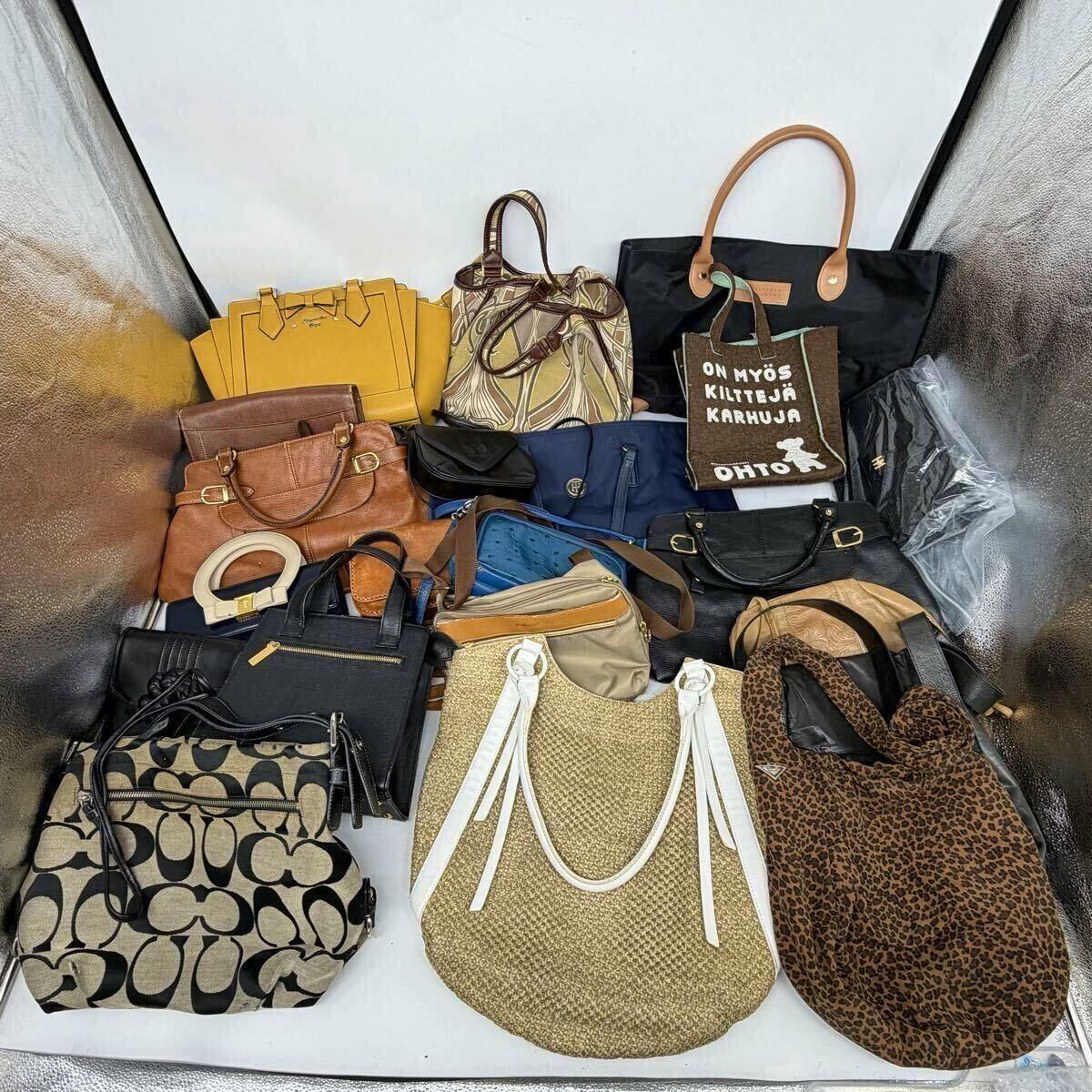 A collection of assorted handbags, totes, and pouches arranged together on a white surface.
