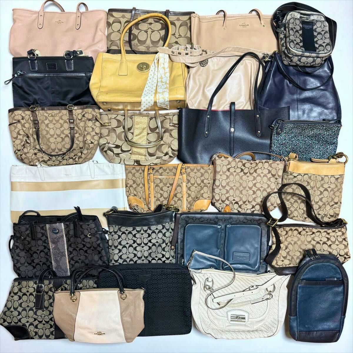 Top-down photo of multiple Coach bags and purses arranged on a flat surface.