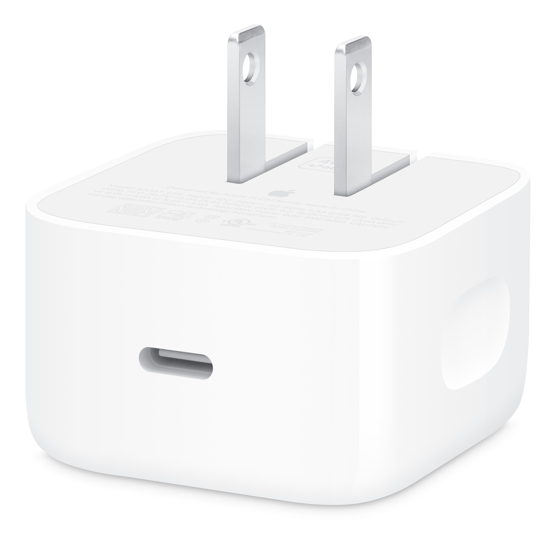 White compact AC adapter with two flat prongs and a USB‑C port visible on the front.