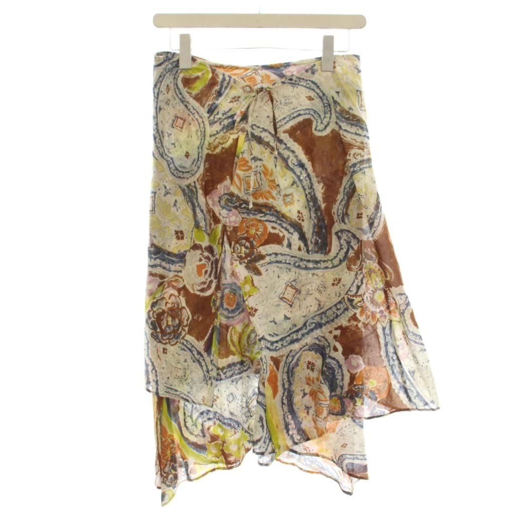 A women's knee-length patterned wrap skirt in brown and gray tones hanging on a hanger against a white background.