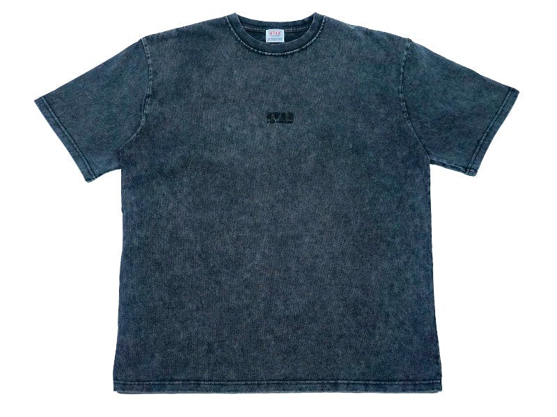 Front view of the black 4T4A sKetChboOok3 T-shirt laid flat showing a small chest graphic.