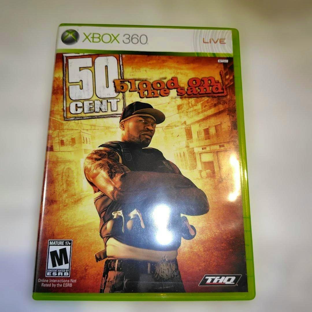 Front cover photo of the Xbox 360 game case for 50 Cent: Blood on the Sand showing the title and 50 Cent with his arms crossed.
