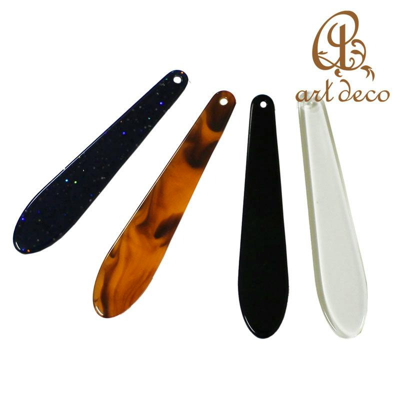 Four 60mm obi decorative plate bookmarks in dark glitter, tortoiseshell, black, and transparent finishes.