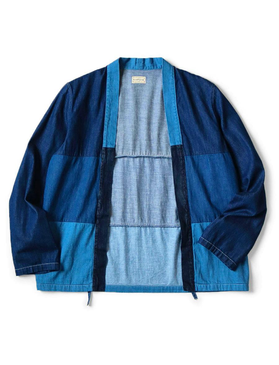 Front view of the 8oz denim 4-tone Kakashi shirt laid flat, showing an open front and long sleeves in varying blue tones.