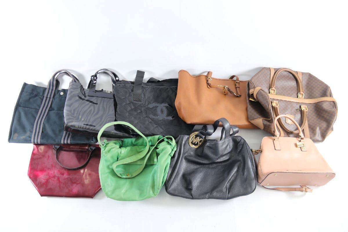 Nine assorted handbags and shoulder bags in various colors and materials (canvas and leather) arranged on a white background.