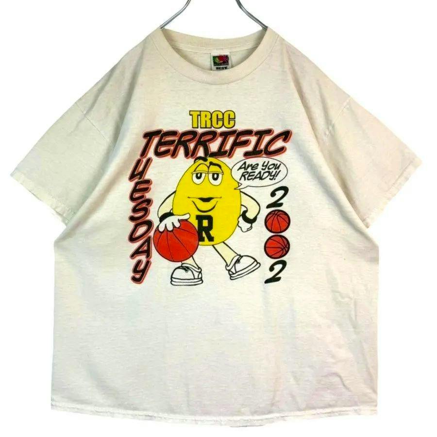 Front view of an off-white men's short-sleeve Fruit of the Loom cotton T-shirt with a large yellow cartoon character holding a basketball and printed text 'TRCC' and 'TERRIFIC'.