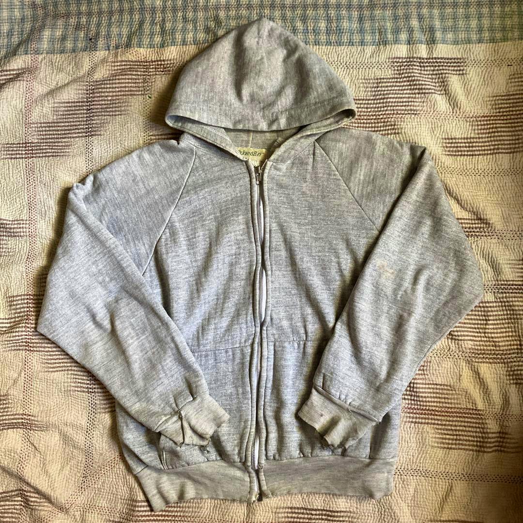 Gray St. John's Bay zip-up cotton hoodie laid flat showing the hood, zipper, sleeves, and front pockets.