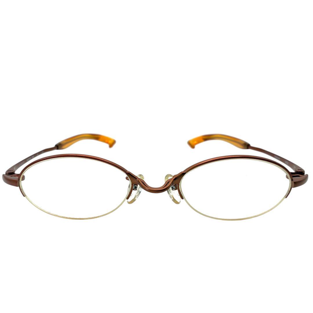 Front view of brown half-rim oval 999.9 prescription eyeglasses on a white background.