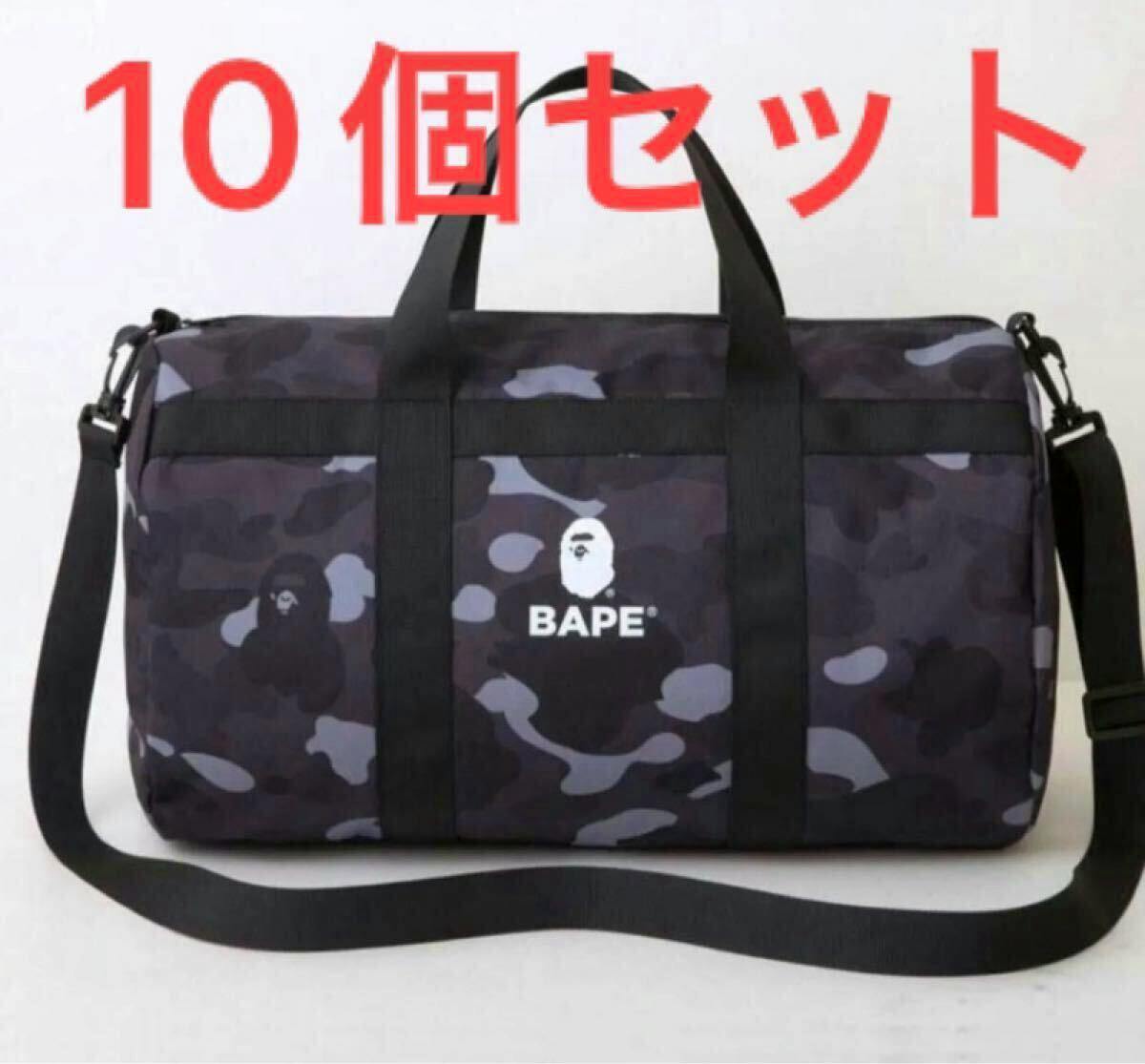 Front view of a black camo BAPE duffle bag with top handles, shoulder strap, and a white BAPE logo on the front.