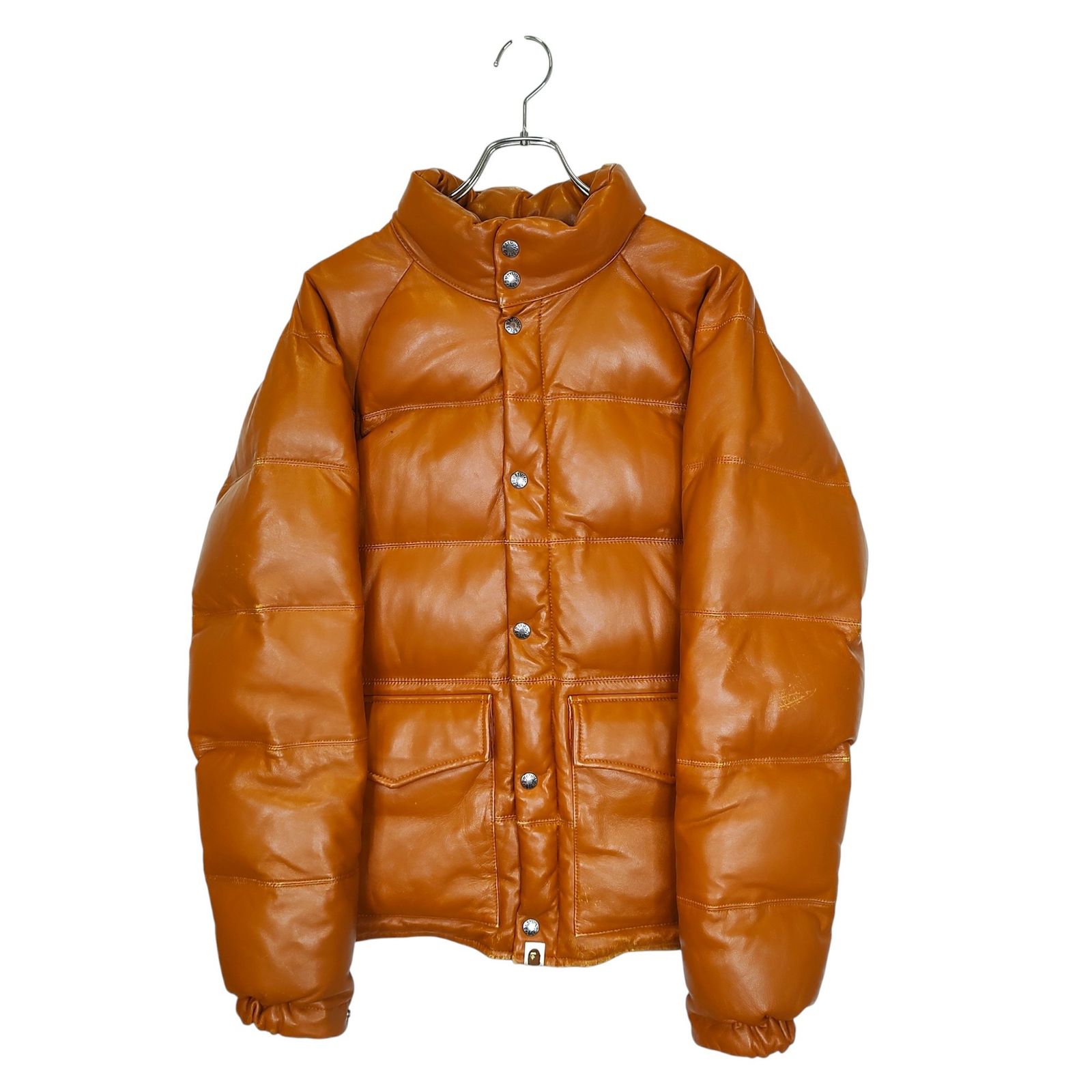 Brown lambskin leather down jacket (A BATHING APE) on a hanger, front view.