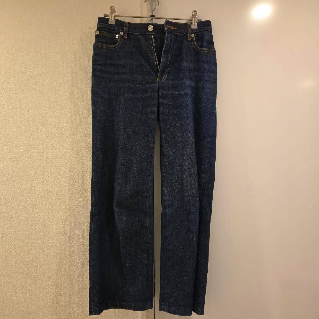 Front view of A.P.C. women's denim jeans (size 25) hanging on a clip hanger.