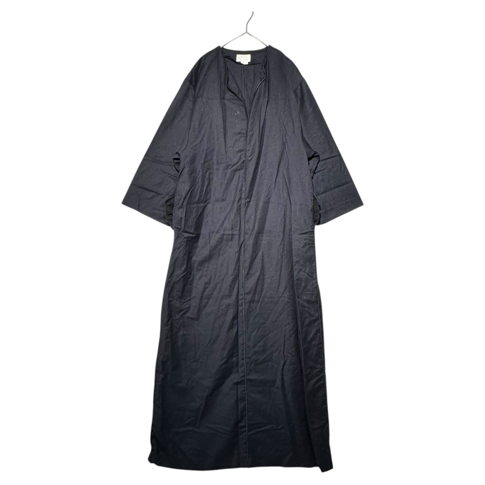 A.P.C. Suzanne Koller navy center-piping wool long dress hanging on a hanger against a white background.