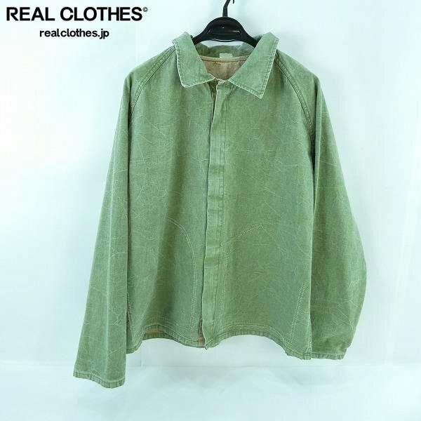 Green A.PRESSE vintage reversible hunting jacket hanging on a black hanger against a white background.