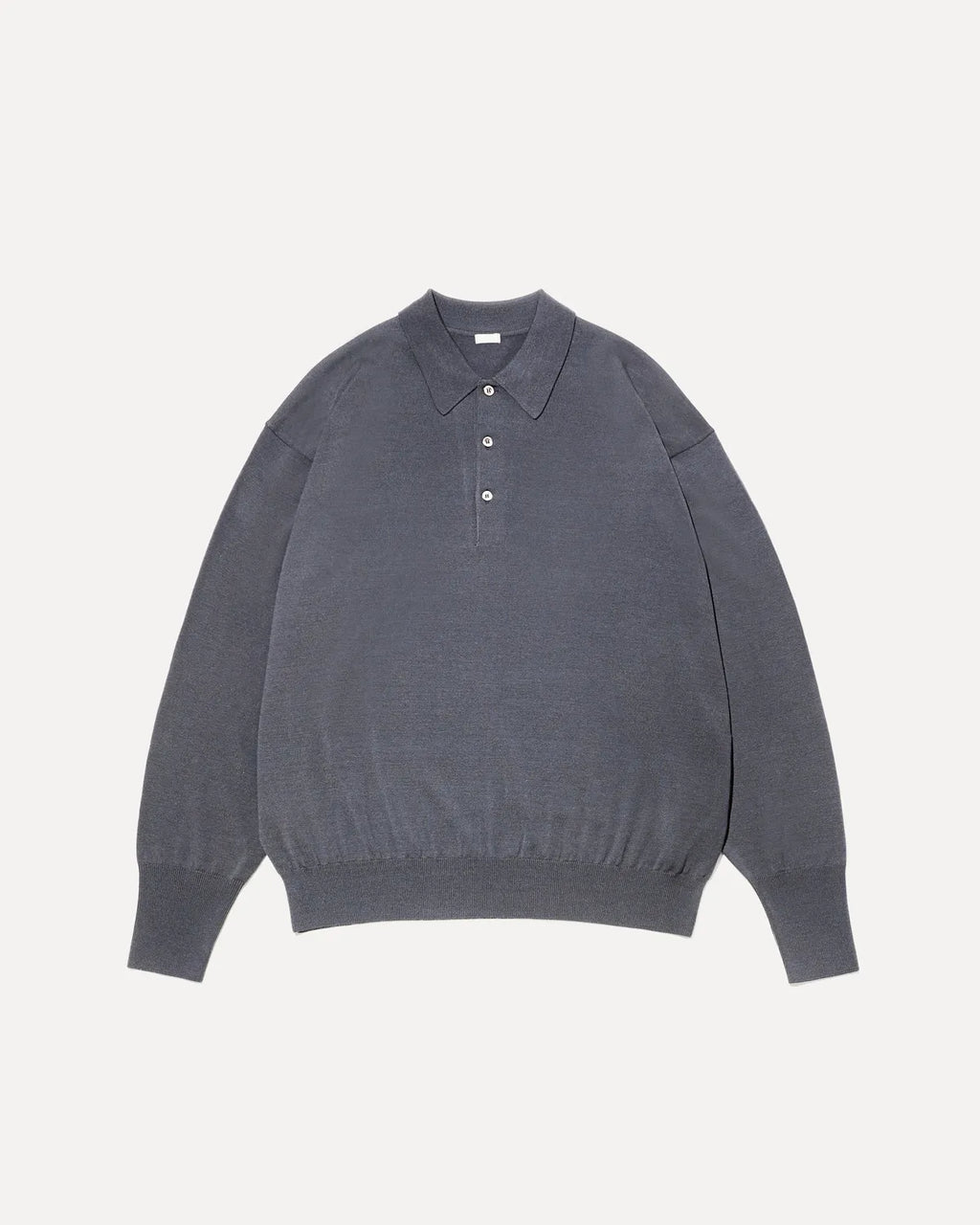 Flat-lay photo of a women's wool long-sleeve polo shirt in dark gray with a pointed collar, three-button placket, and ribbed cuffs and hem.