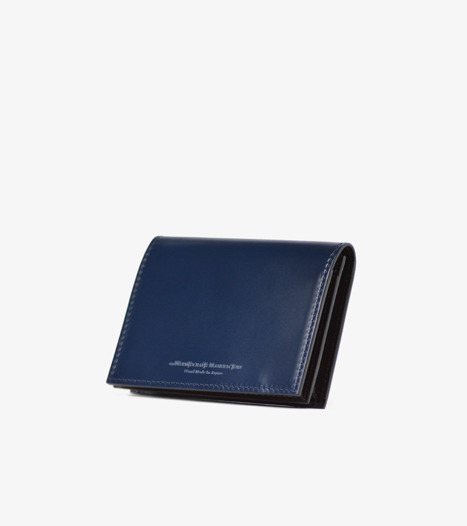 Navy cordovan cow leather card case shown closed on a white background.