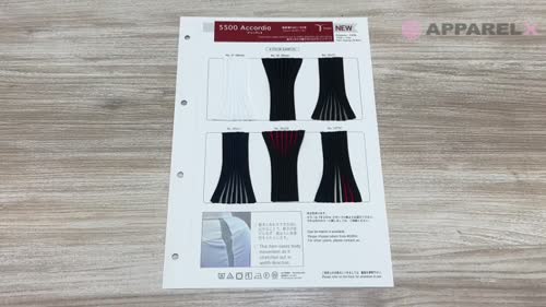 Photograph of a sample sheet showing accordion-style tape/plastic samples laid on a wood surface.
