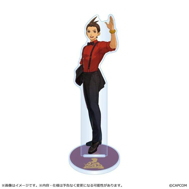 Acrylic stand showing a full-body illustration of a male character wearing a red shirt and black pants, standing on a round 25th‑anniversary base.